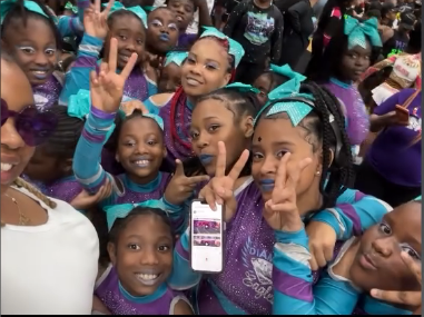 Diamond Eagles athletes gathered close together for a group photo after competing